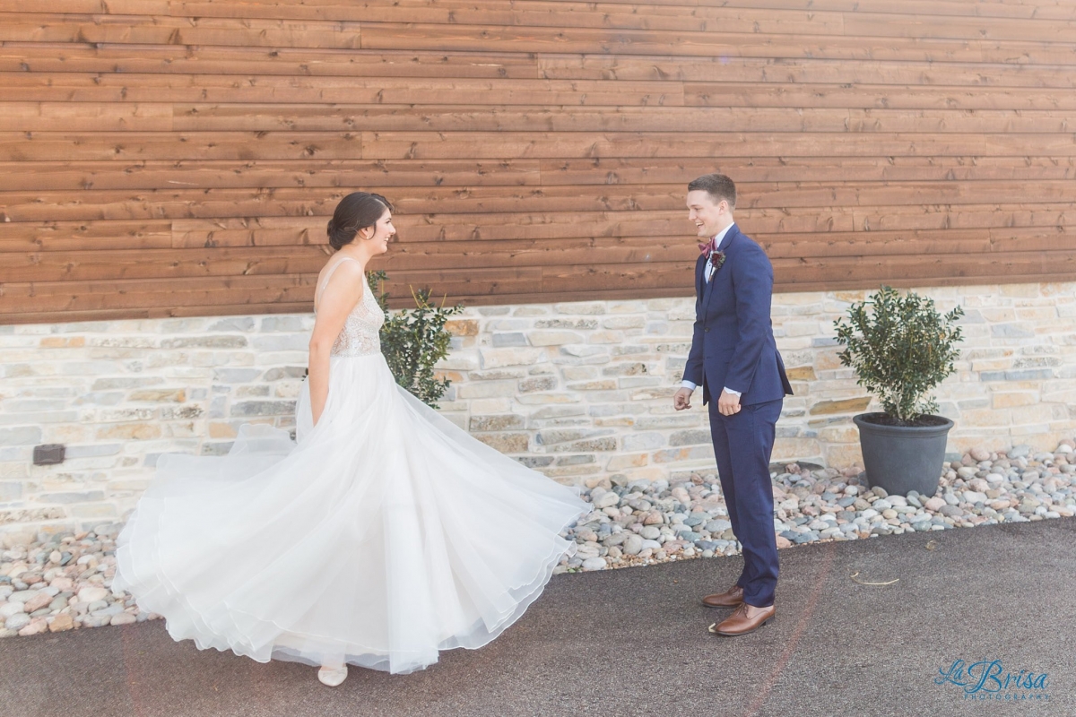 bride twirls for groom during first look stone crest