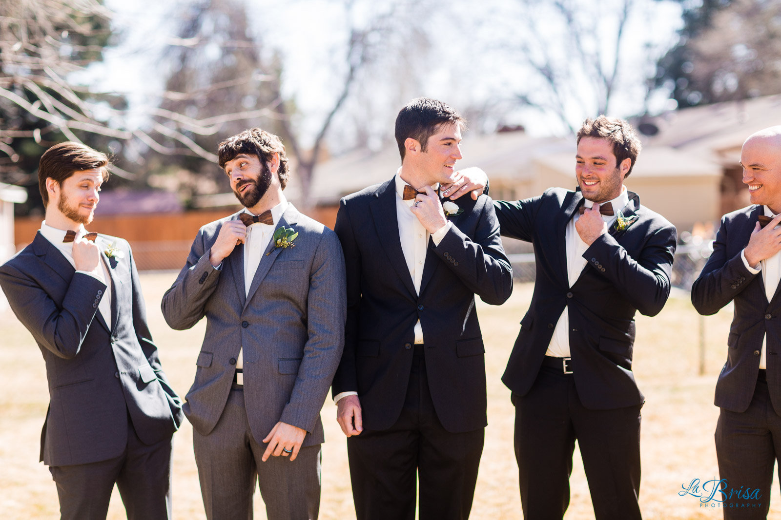 Groomsmen adjusting bowties fort collins