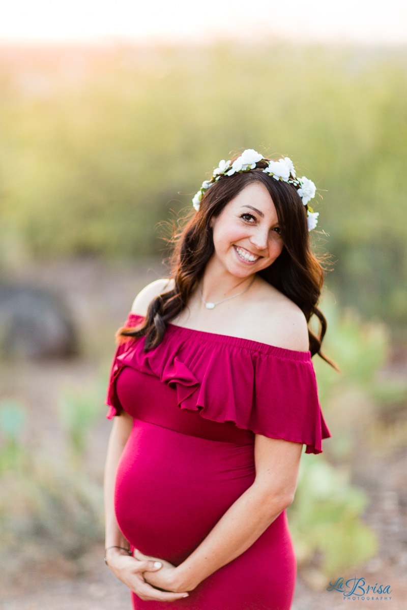 Red maternity dress flower crown desert