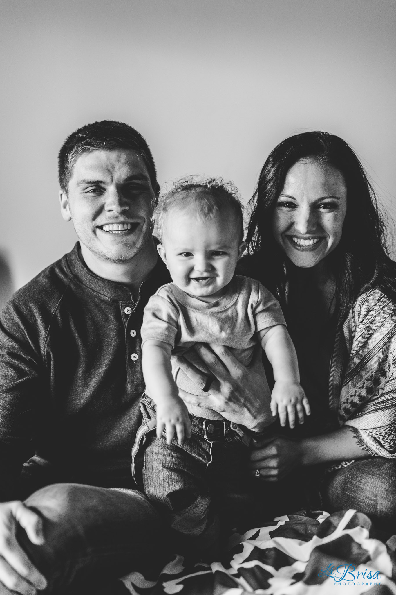 tucson family photo smiling on bed