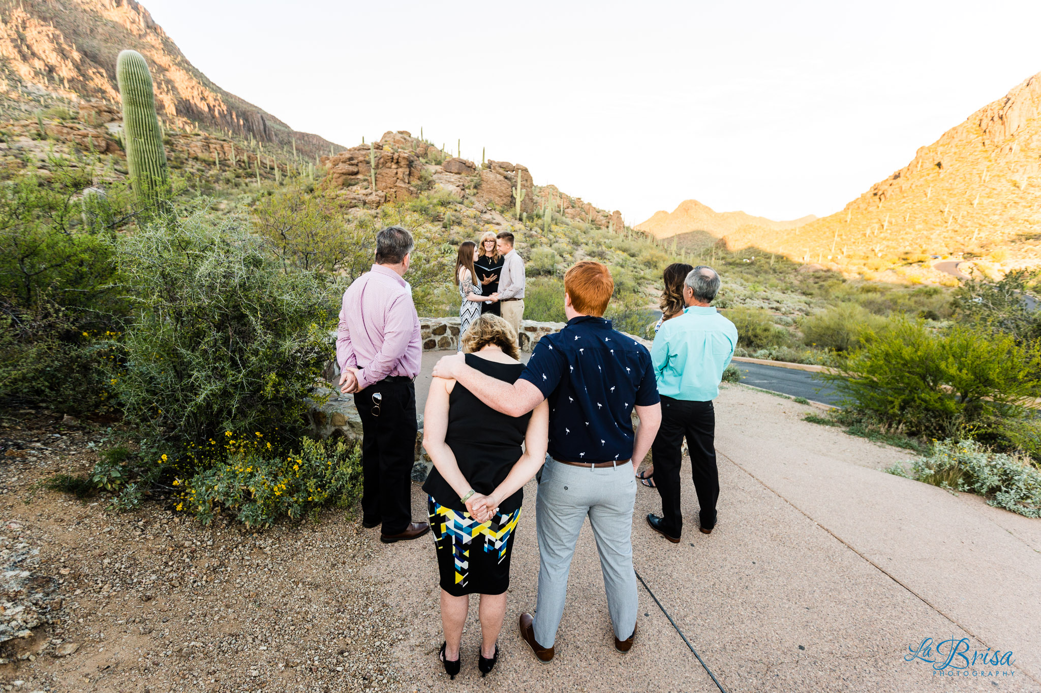 family hugging Gates Pass elopement