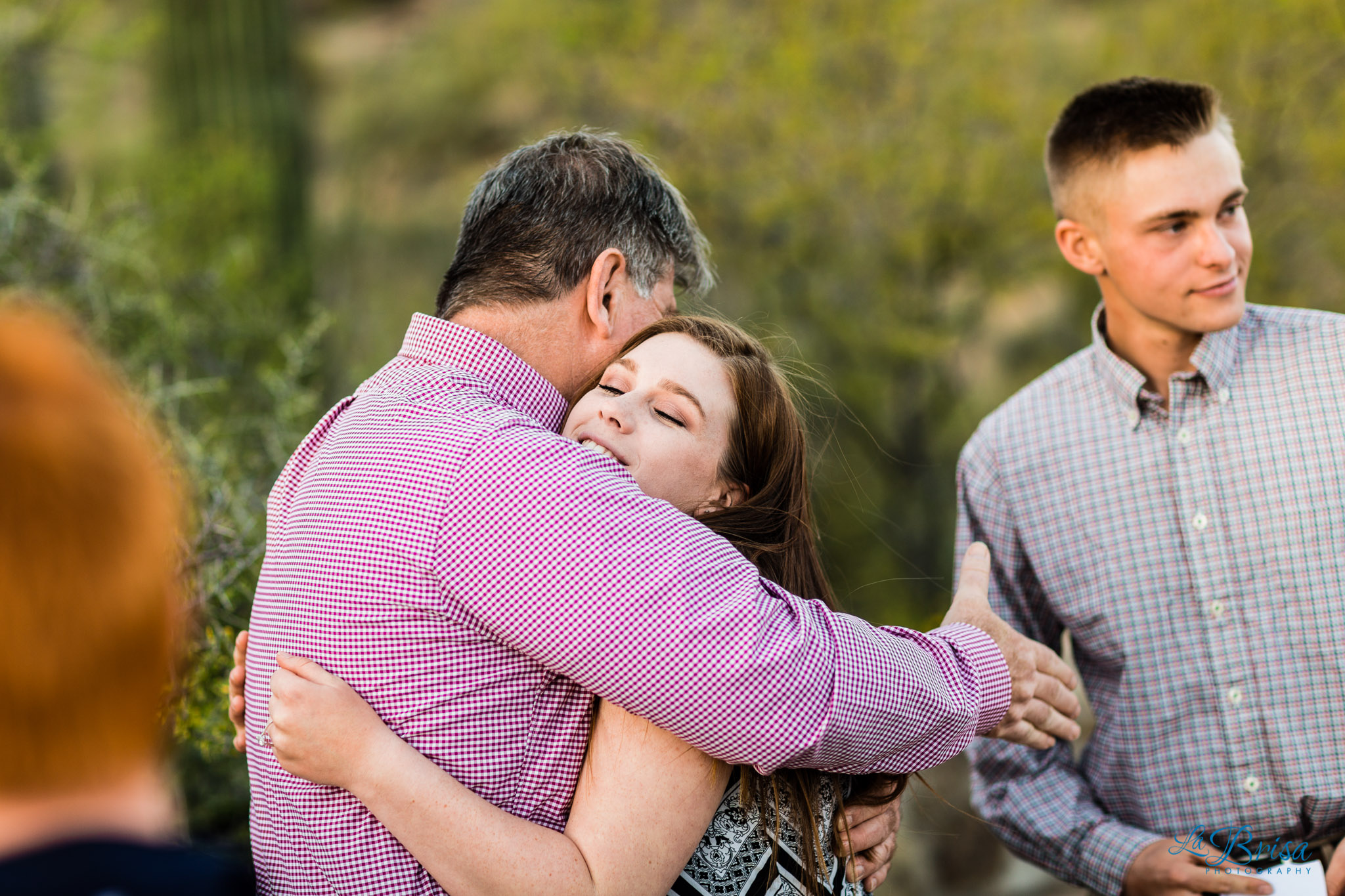 father hugging bride Gates Pass wedding